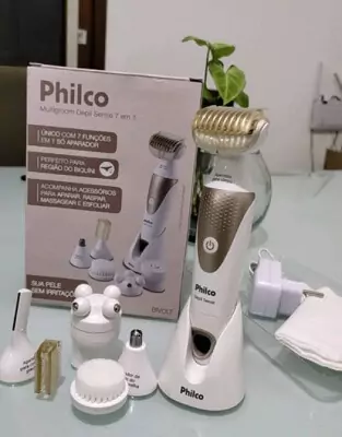 Philco Depil Sense preso em seu suporte com seus acessórios ao lado e sua caixa ao fundo.